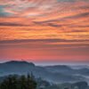Roland Seichter Fotografie - Einzigartige Wandbilder - Landschaftsfotografie - Steirischer Sonnenaufgang mit viel rotem Himmel über der Steiermark