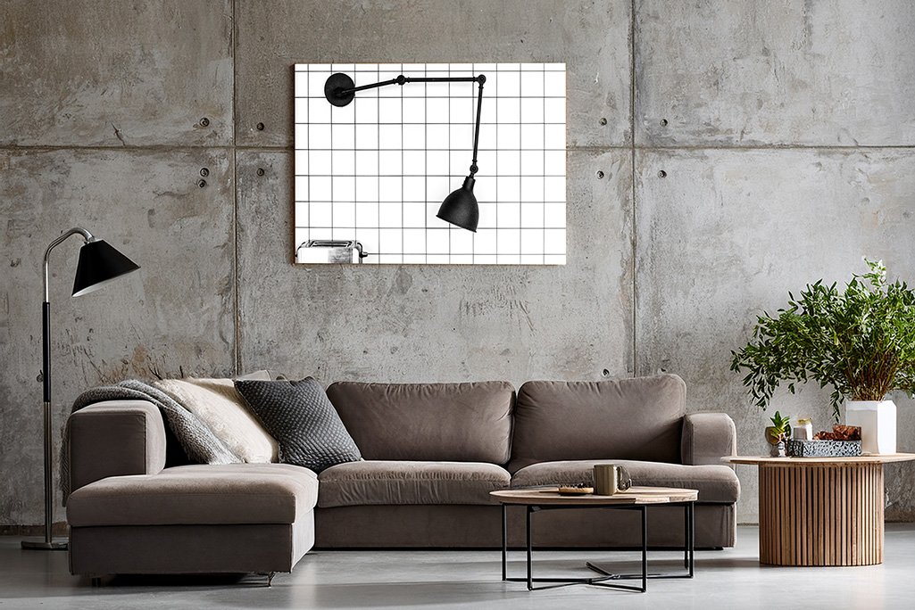 Das Wandbild "Toaster" in einem minimalistischen Wohnzimmer mit Sichtbetonwänden zur Unterstreichung des Industrial-Designs.