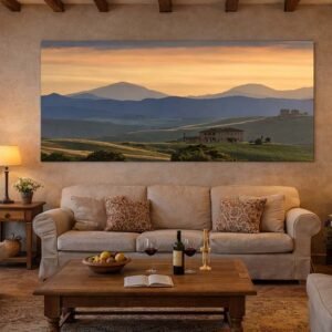 Das Wandbild Toskanischer Abend als stimmungsvolles Panorama über einer modernen Couch in einem hellen Wohnzimmer